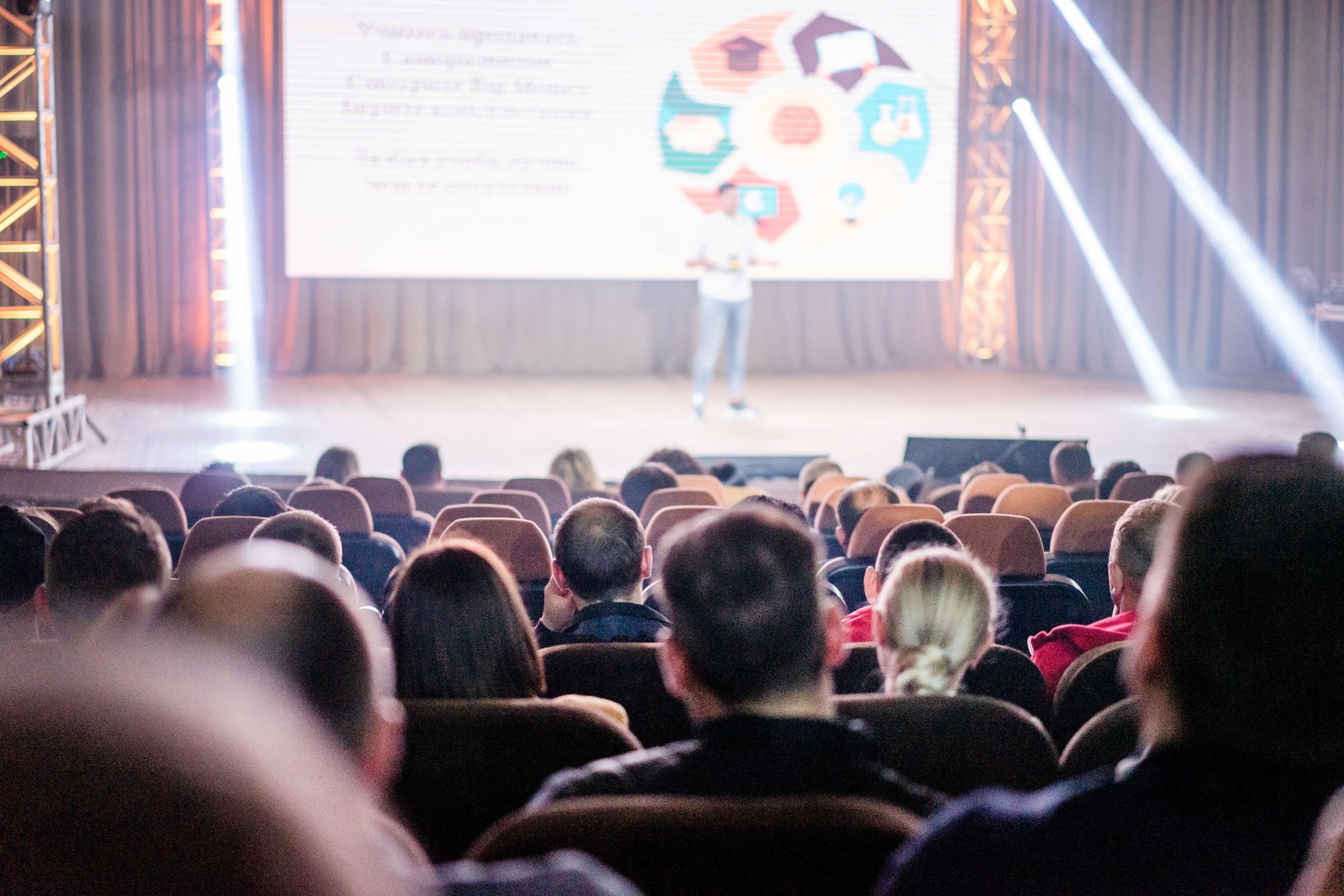 Audience watching a conference stage